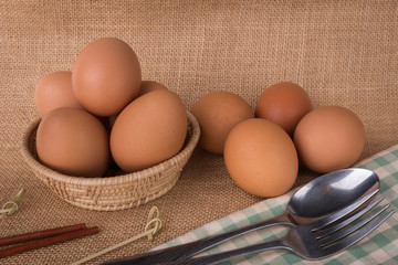 Set Eggs in a basket on  gunny (sackcloth)  background