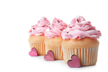 Delicious vanilla cupcakes on white background