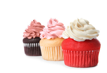 Delicious cupcakes on white background