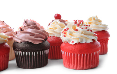 Delicious cupcakes on white background