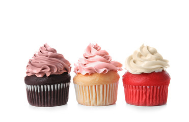 Delicious cupcakes on white background