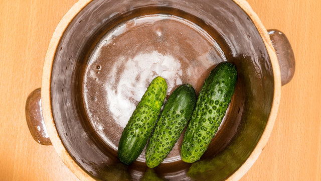 Making pickled cucumbers in clay jar