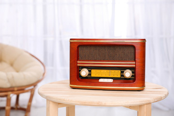 Stylish radio on table in room
