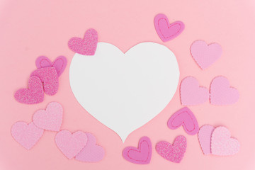 Valentines day frame with hearts on pink background with copy space