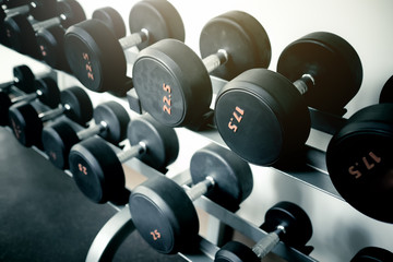 Sports dumbbells in modern sports club. Weight Training Equipment