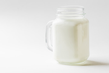 Glass of milk isolated on white