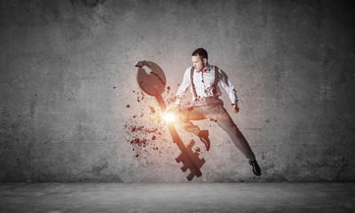 Breaking through access concept with furious man in room crashin