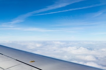 Fototapeta na wymiar Over the clouds. Photo from plane.