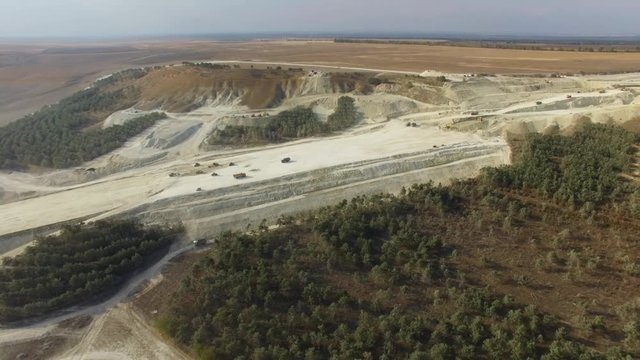 AERIAL: Limestone quarry / AERIAL: Flying along limestone quarry  