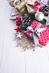 Christmas background with gift boxs, christmas tree, mittens and decorations