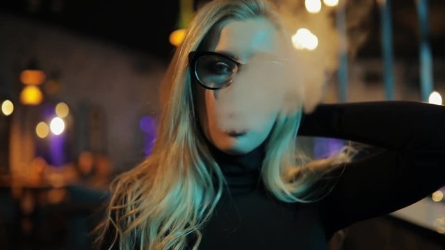 Blonde woman smoke hookah