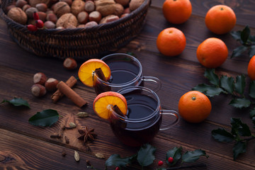Christmas mulled wine with spices wooden background