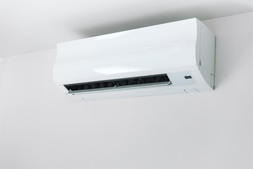 Air conditioner on white wall