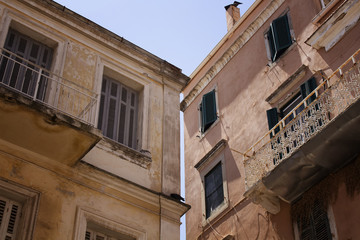 Old, historical buildings in Corfu (Kerkyra) town. It's an island of Greece’s northwest coast in the Ionian Sea. Cultural heritage reflects years spent under Venetian, French and British rule.