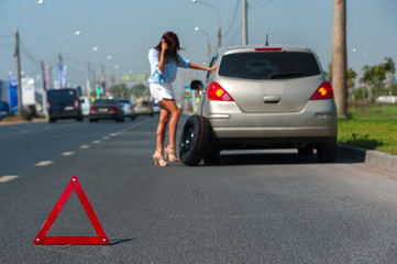 Beautiful woman has problem with the car