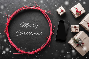 xmas background with gifts and mobile phone space with christmas snowing message. bakgraund. flat