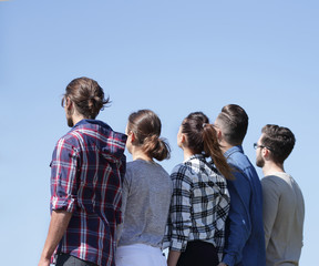 rear view .a group of students looking at copy space.