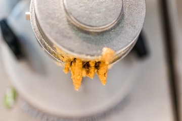 Leftover peanut butter on machine grinder