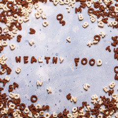 Dry breakfast, granola, muesli on a gray background, square, top view, copyspace, flat lay