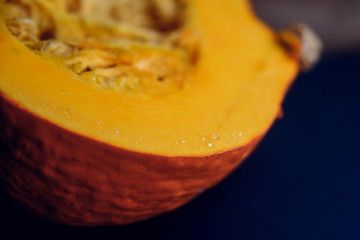 Set of orange pumpkins on wood flat lay free space. Fresh cut squashes on wooden table, country autumn background. Seasonal, harvest, fall, organic food, dieting, healthy food concept