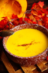Pumpkin soup on a wooden table