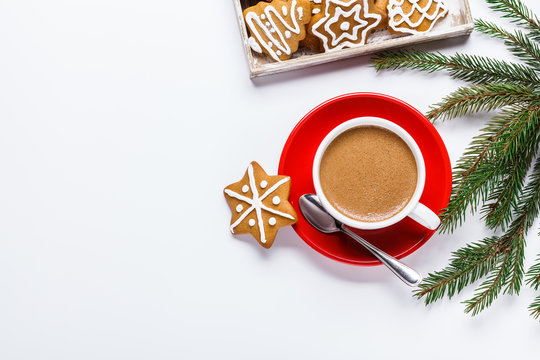 Christmas cookies in a white wooden box with hot chocolate and marshmelow, on a light background.