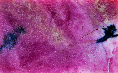 Rhodonite, ruby spar mineral stone texture pattern macro view. Beautiful background rose-red color...