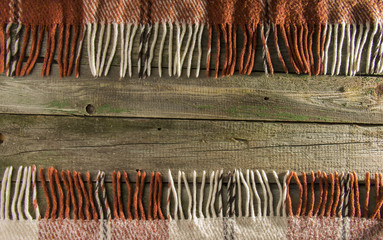 Background, old boards with faded paint, and checkered plaid