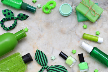 Fototapeta na wymiar Lime mint composition beauty treatment products in green colors: shampoo, soap, bath salt, towel, oil. Various bath accessories. Items for the spa