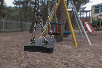 Playground and swinging and playground tube. Concept: children and vacation / travel