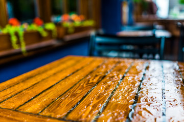 Wet table closeup outside restaurant during heavy rain