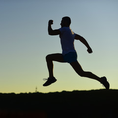 Fototapeta na wymiar Sport and training concept. Sportsman jogging in evening.