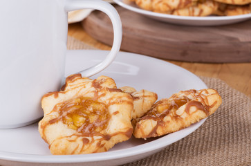 Apple Caramel Cookies With a Coffee Cup on a Plate