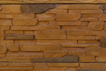 Old brown stone wall as a background, texture