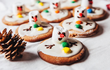 Army of melted snowmans on ginger cookies.