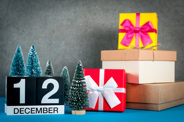 December 12th. Image 12 day of december month, calendar at christmas and new year background with gifts and little Christmas tree