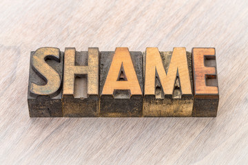 shame word abstract in wood type