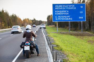 The Kola northern highway with information board with distances to Karelian cities. Karelia, Russia