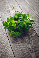 Green mint on the wooden table