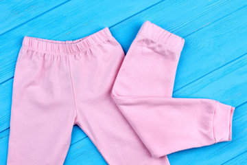 Trendy pink trousers for little girls. Soft natural leggings for infant girls, new collection. Stylish cothes for kids.