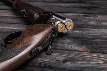 open hunting rifle on a wooden background