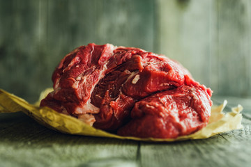 Raw meat on a wooden background