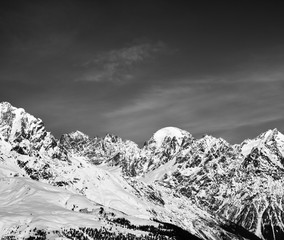 Obraz premium Black and white snowy mountains in winter at sun day