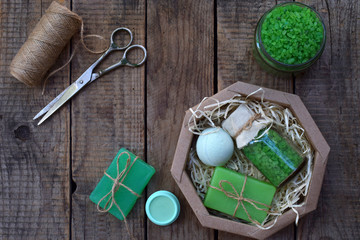 Lime mint composition beauty treatment products in green colors: shampoo, soap, bath salt, towel, oil. Various bath accessories. Items for the spa