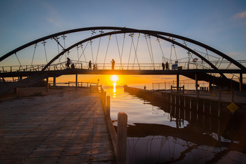 Fototapeta premium The beautiful sunset over the bridge in Frankston beach one of the suburbs in Melbourne, Australia.