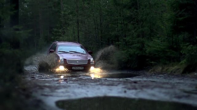 Car crosses dirt in slow motion