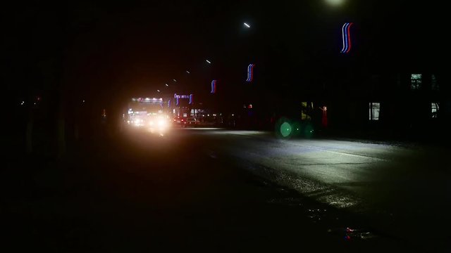 Night traffic city cars, headlight lights.
