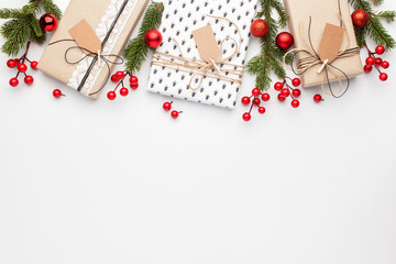 Christmas composition. Border made of christmas decoration on white background. Flat lay, top view.