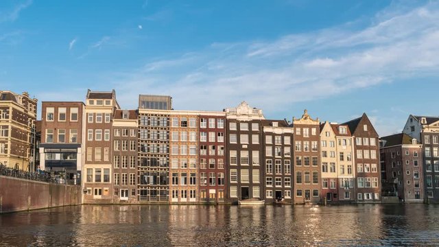 Amsterdam city skyline timelapse at Damrak canal waterfront, Amsterdam, Netherlands 4K Time Lapse