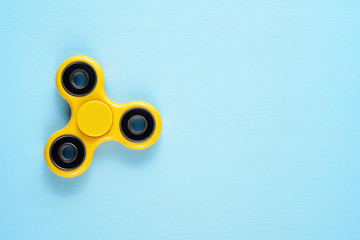 Fidget spinner toy on blue background - 181686464